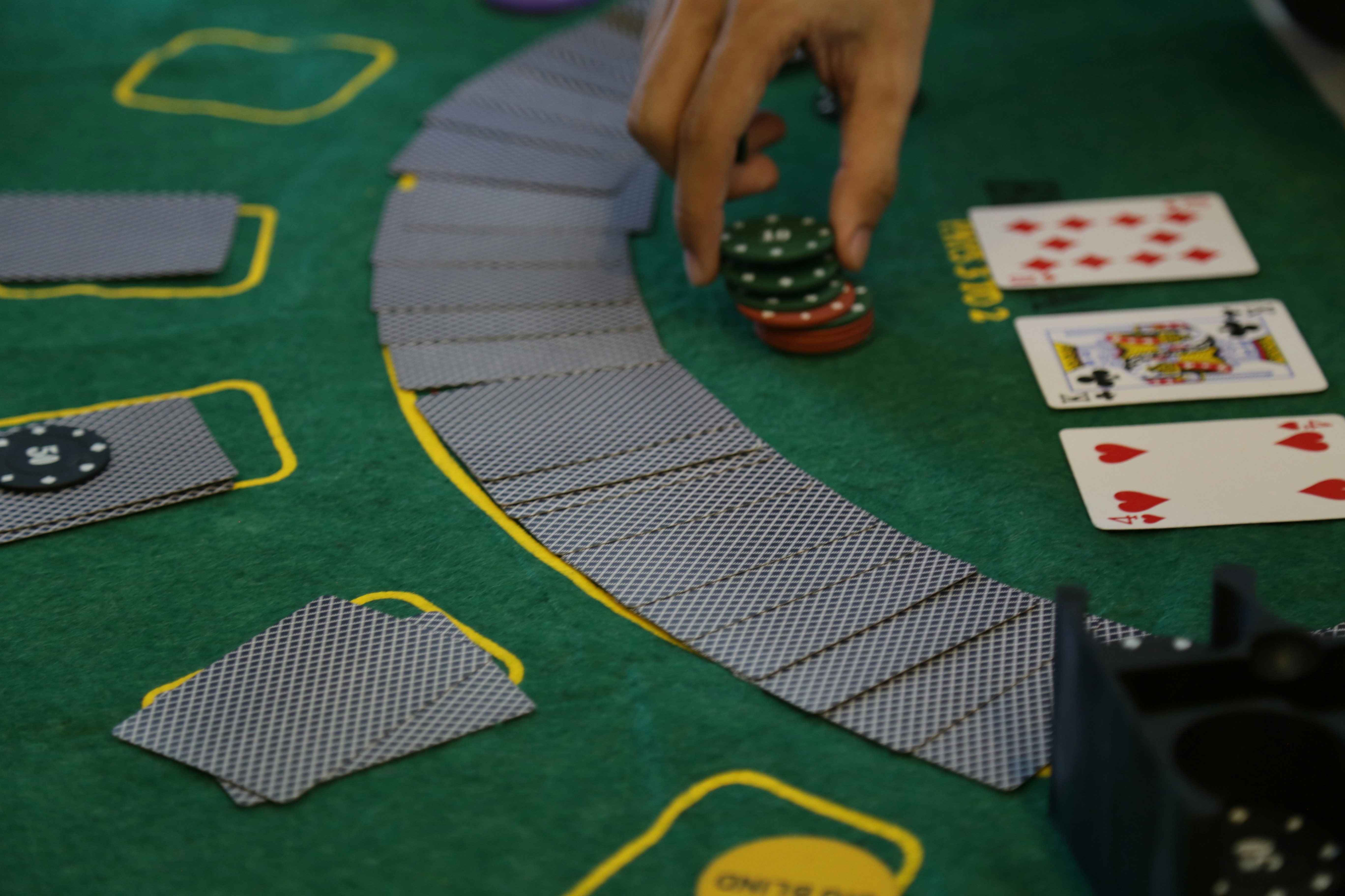 a person playing a game of cards on a table